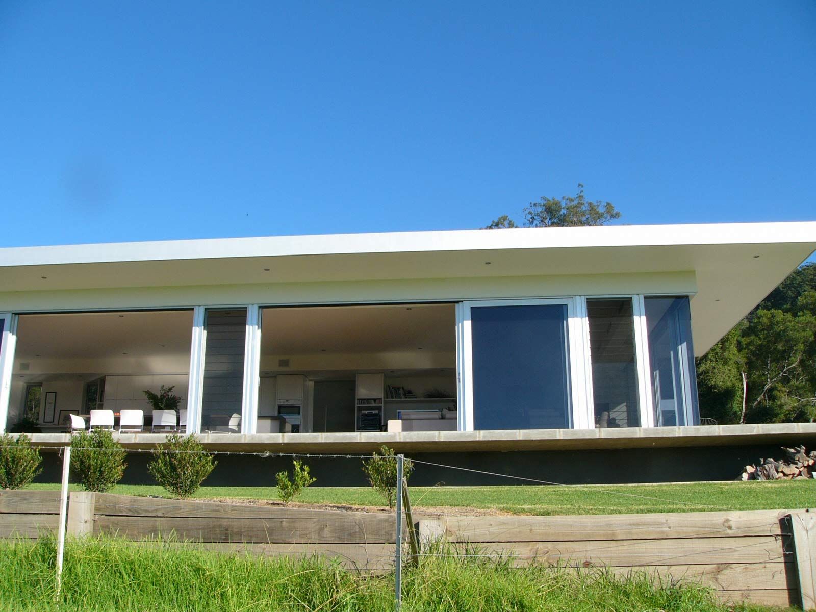 A House with Sliding Door in a Patio — Glass Windows & Doors in Shoalhaven, NSW