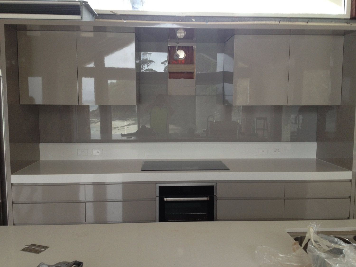A Kitchen with a Grey Wall Splashback — Glass Windows & Doors in Shoalhaven, NSW