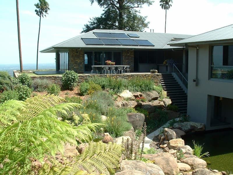 A House That Has A Lot Of Plants In Front Of It - Previous Projects in South Nowra, NSW