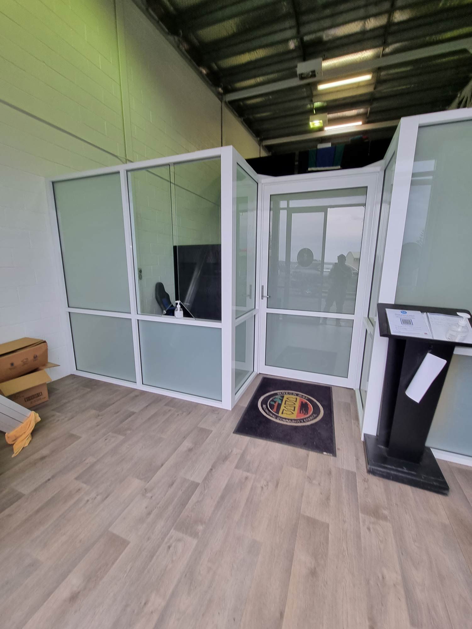 An Office Partition and Door with Privacy Glass — Glass Windows & Doors in Shoalhaven, NSW