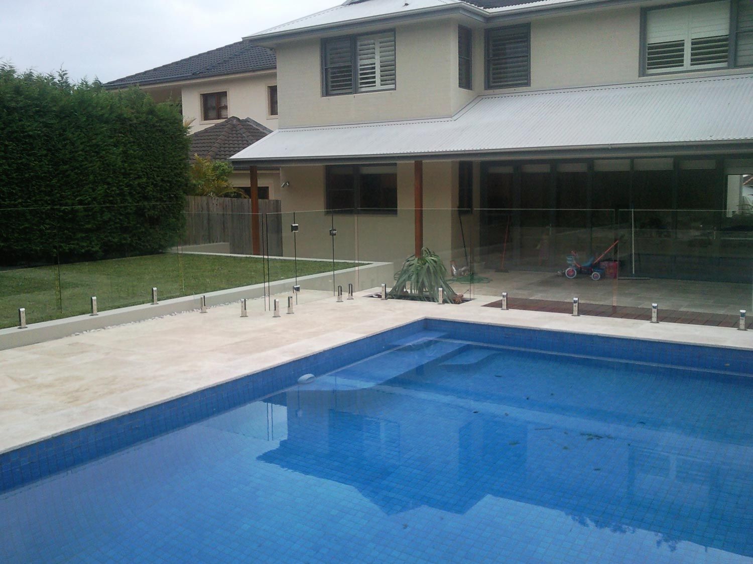 A Clean Pool with Glass Balustrades — Glass Windows & Doors in Shoalhaven, NSW