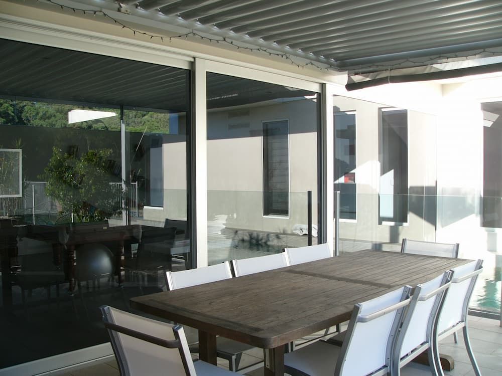 A Wooden Table Sitting Under A Metal Roof - Previous Projects in South Nowra, NSW