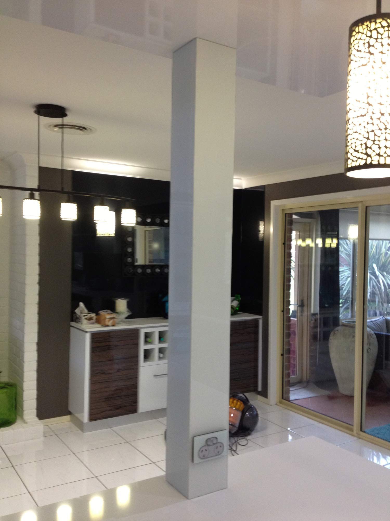 A Kitchen with a Glass Ceiling in Bar Counter — Glass Windows & Doors in Shoalhaven, NSW