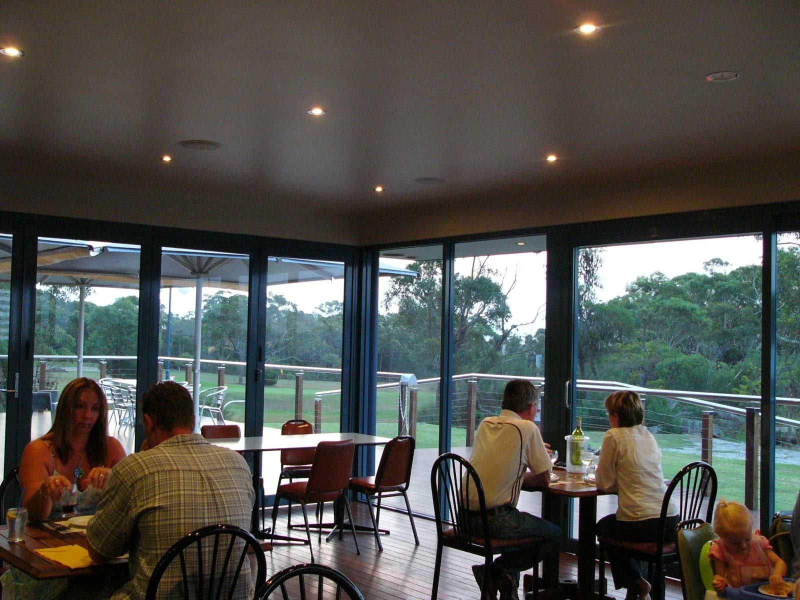 A Shop with Elegant Blue Wall and Glass Windows Interior — Glass Windows & Doors in Shoalhaven, NSW