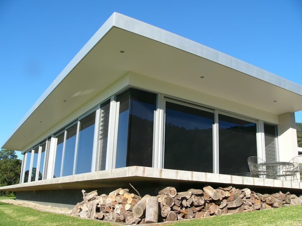 A Lot Of Logs In Front Of A House - Previous Projects in South Nowra, NSW