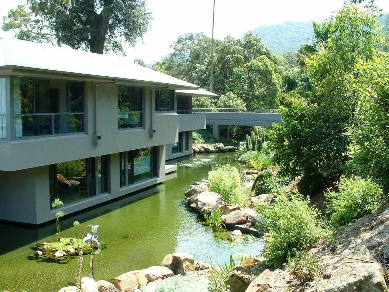 A House Surrounded with Pond — Glass Windows & Doors in Shoalhaven, NSW