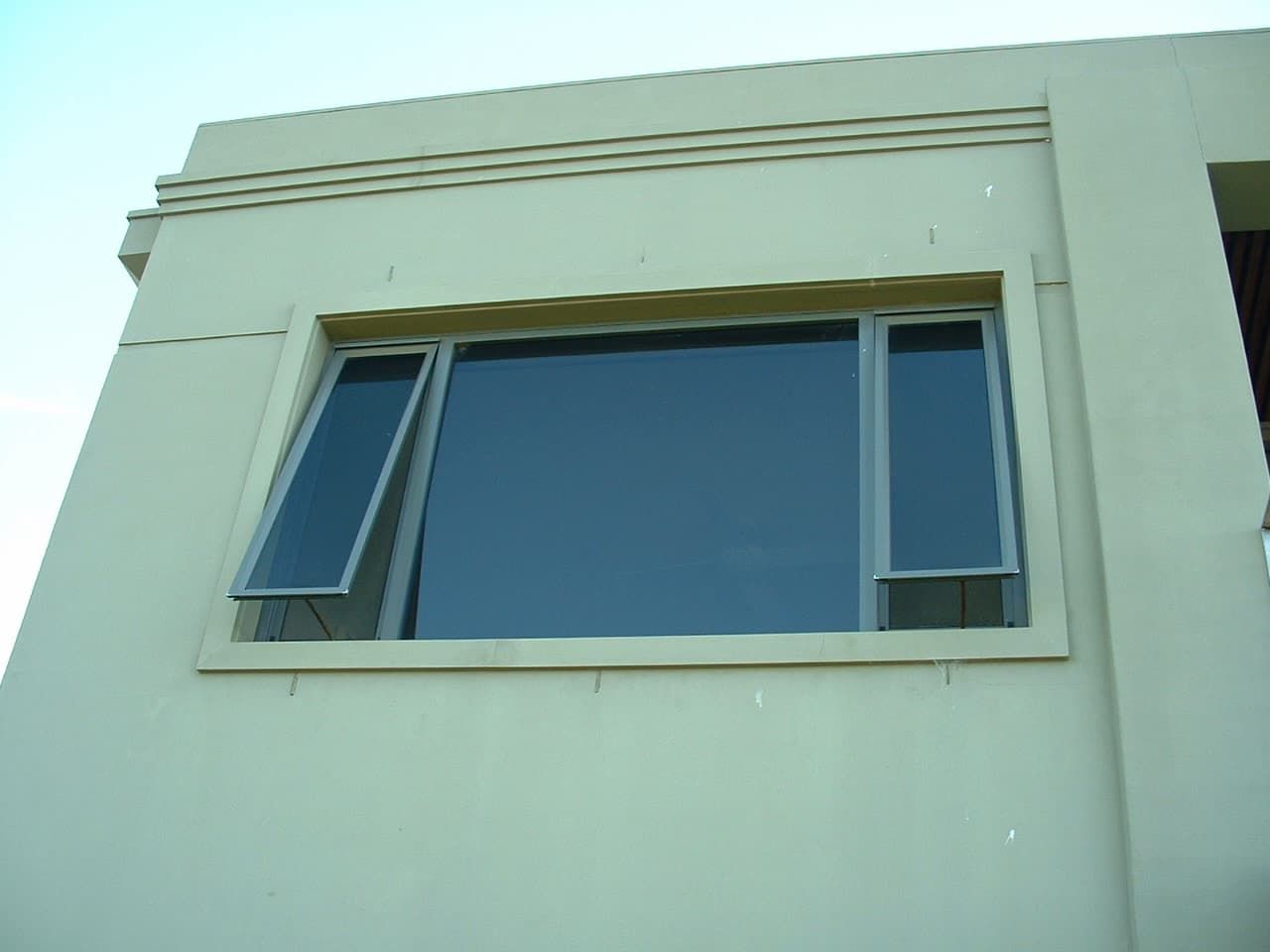 White Building With Two Windows And A Sky Background - Previous Projects in South Nowra, NSW