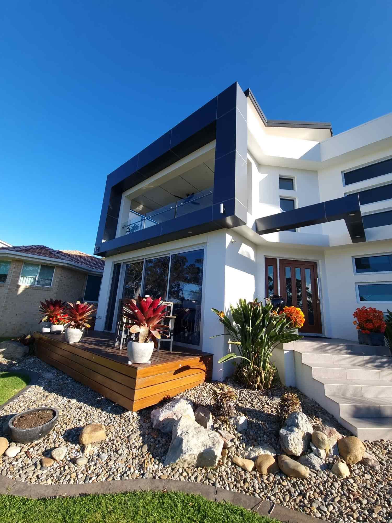 A Newly Build House with Color Blue Highlights — South Coast Glass in Shoalhaven, NSW