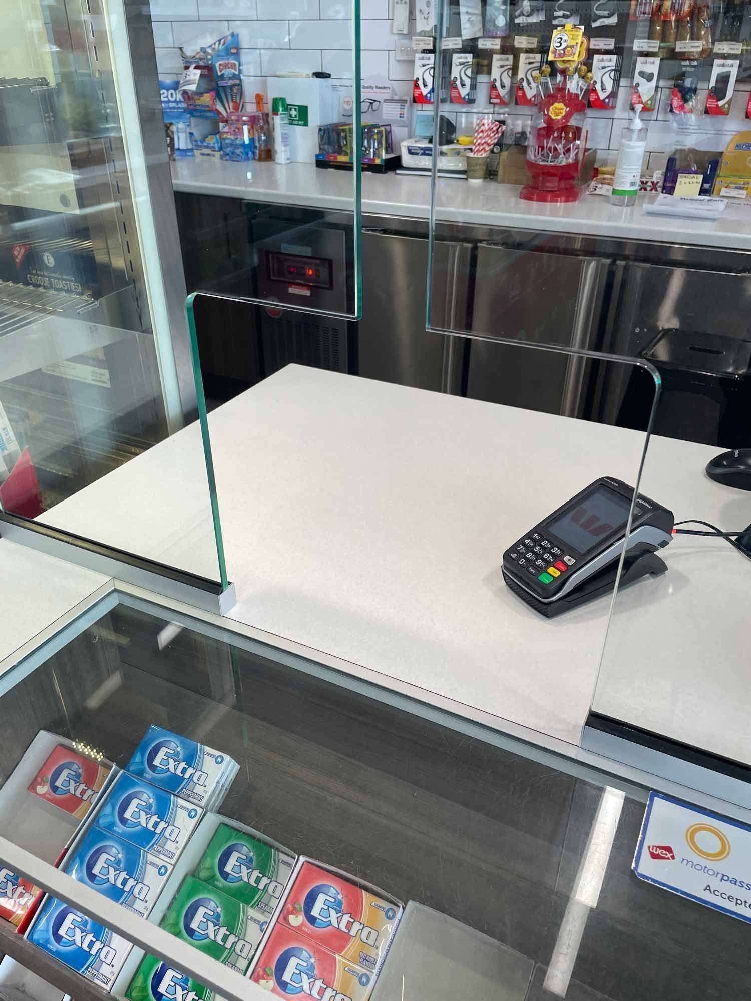 A Counter with a Perfect Cut Glass Partition — Glass Windows & Doors in Shoalhaven, NSW