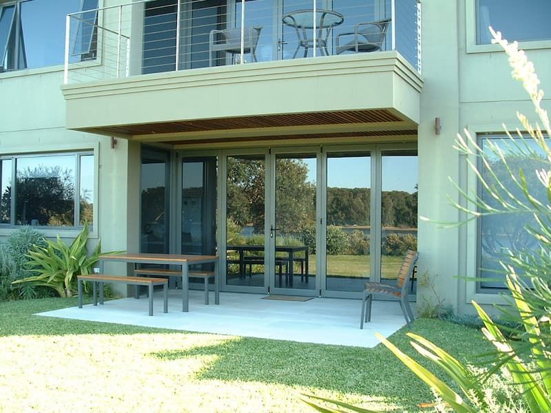 Patio With A Table And Chairs And A Balcony - Previous Projects in South Nowra, NSW