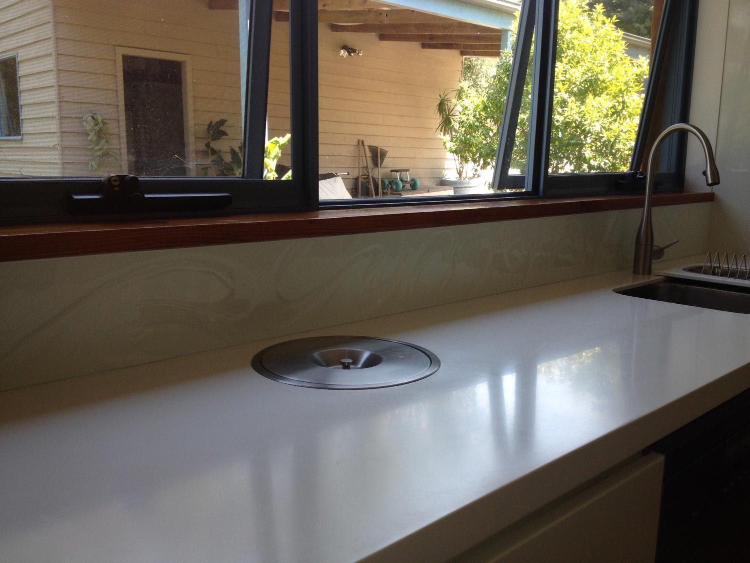 A Kitchen with a White Splashback with Pattern — Glass Windows & Doors in Shoalhaven, NSW