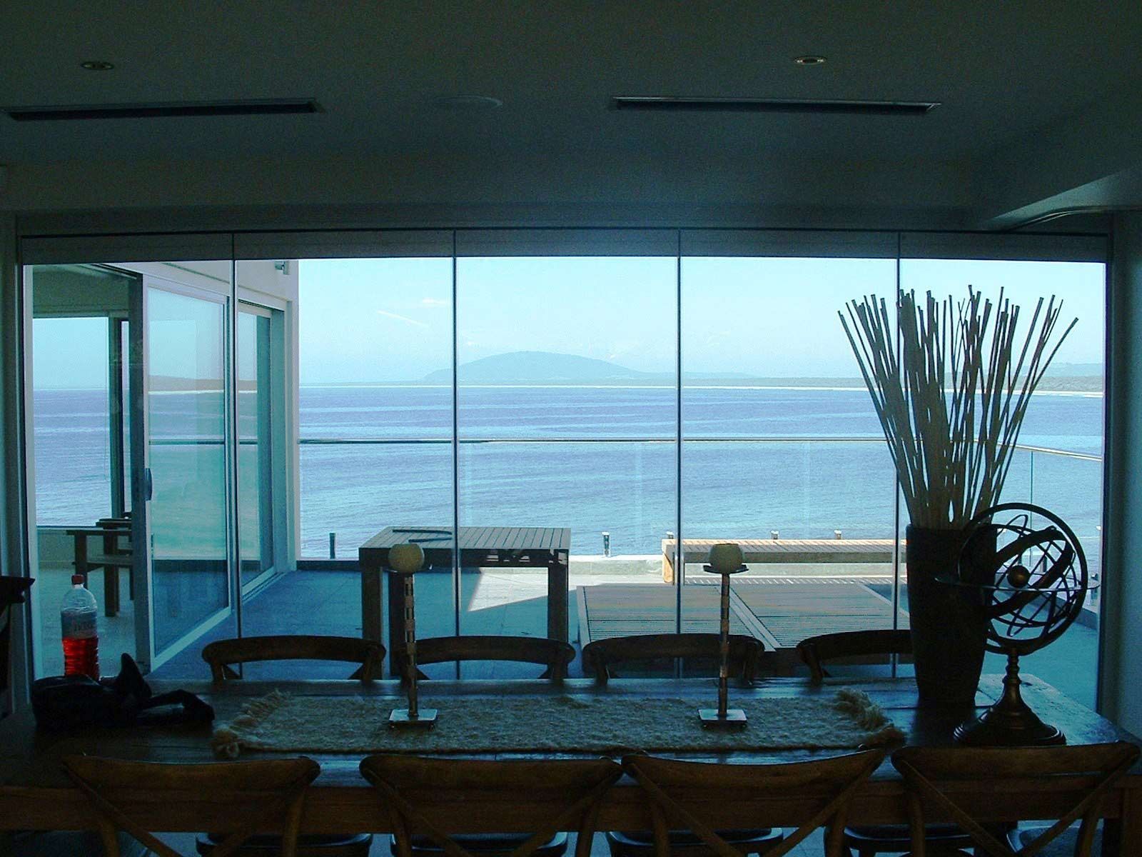Glass Window with a Sea View — Glass Windows & Doors in Shoalhaven, NSW