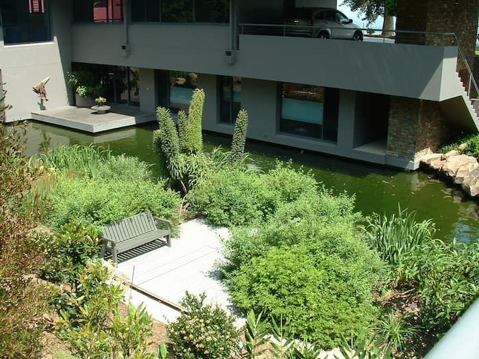 A Bench Sitting In The Middle Of A Garden - Previous Projects in South Nowra, NSW