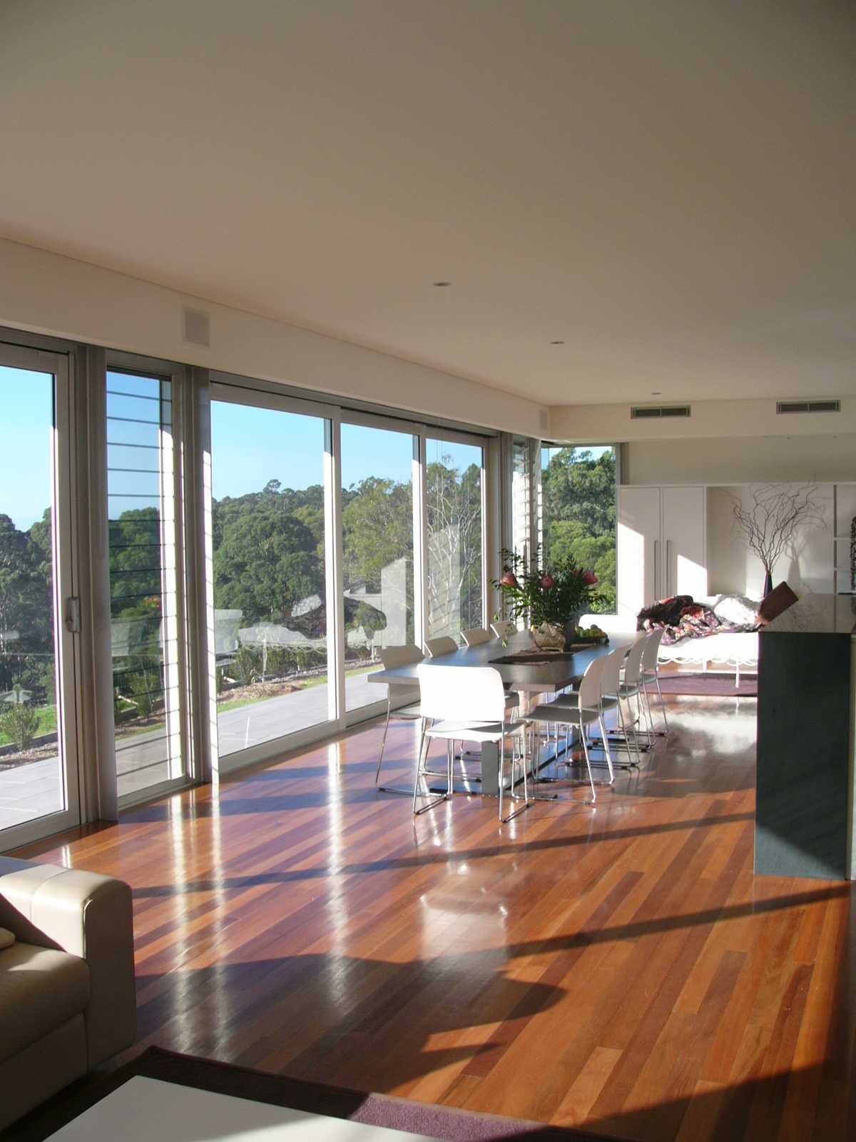 A Modern Living Room with Full View Windows and Sliding Door — South Coast Glass in Shoalhaven, NSW