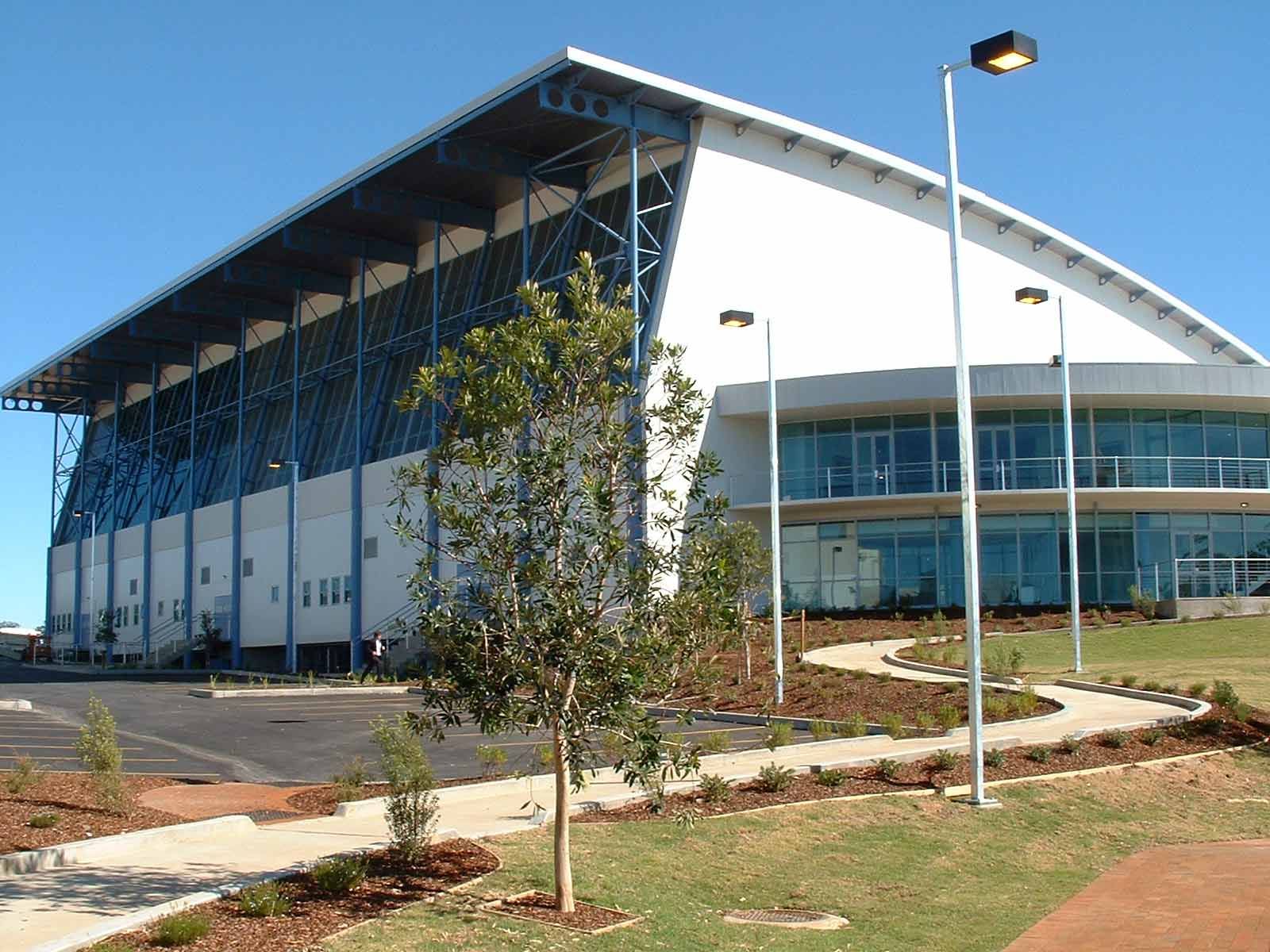 A Stadium with Blue Railings — Glass Windows & Doors in Shoalhaven, NSW