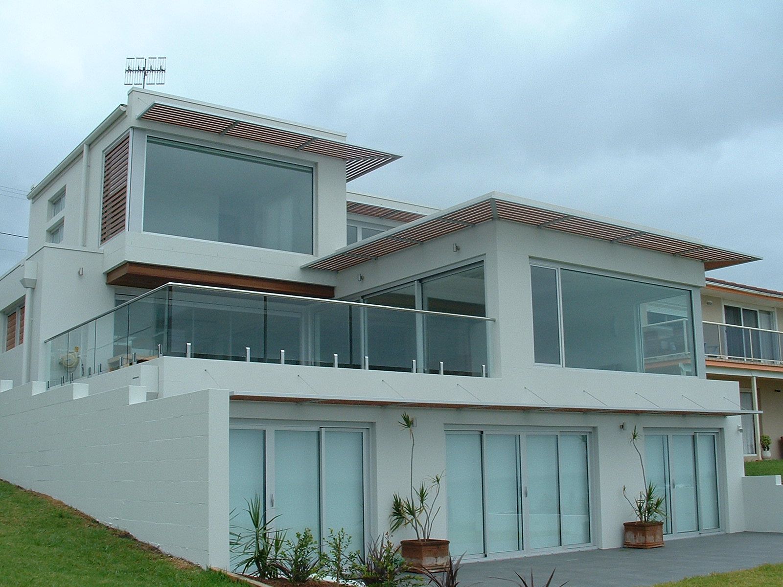 A Modern House with Wood and Glass Doors — South Coast Glass Shoalhaven NSW