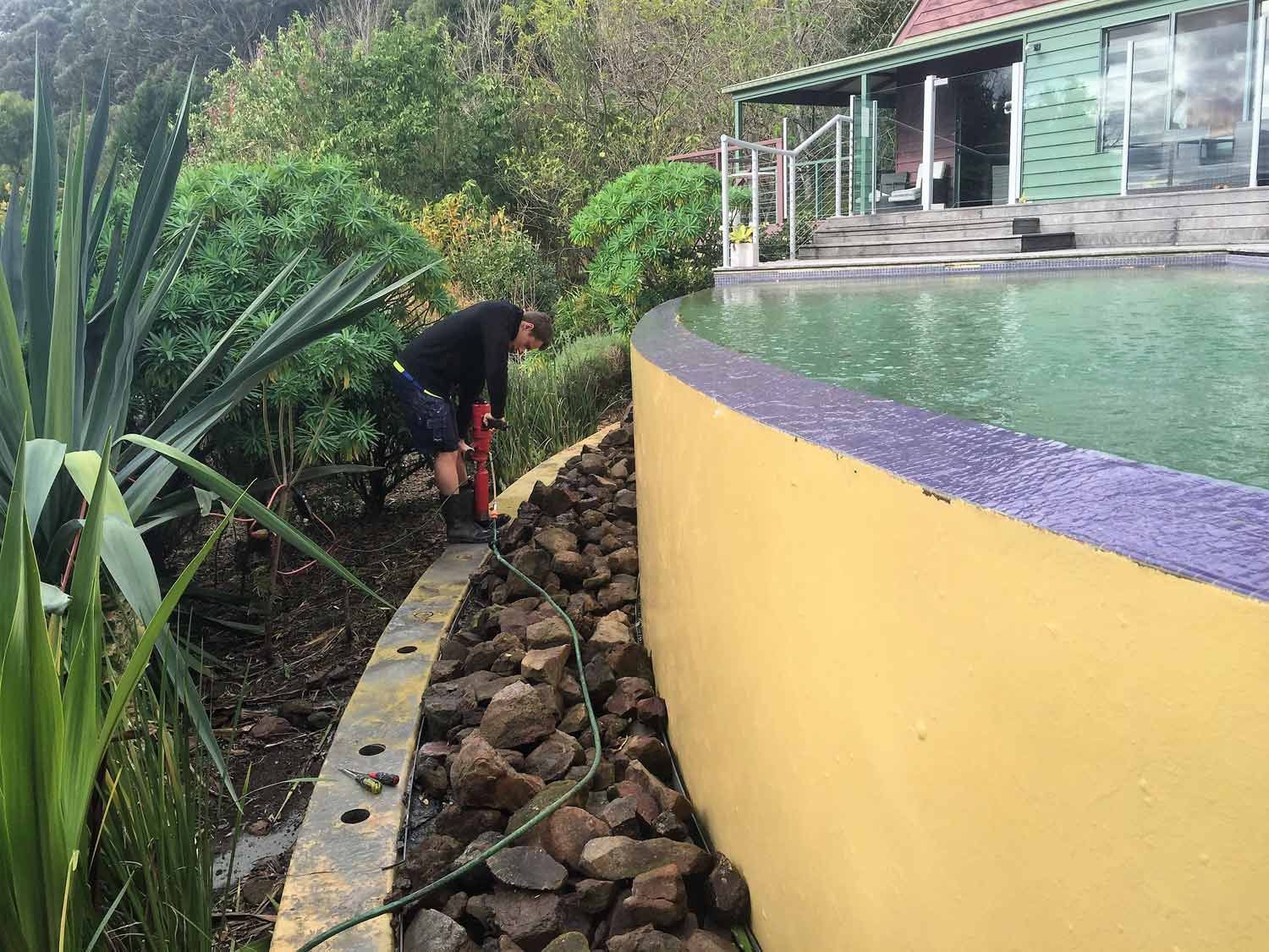 A Pool with Yellow Wall — Glass Windows & Doors in Shoalhaven, NSW