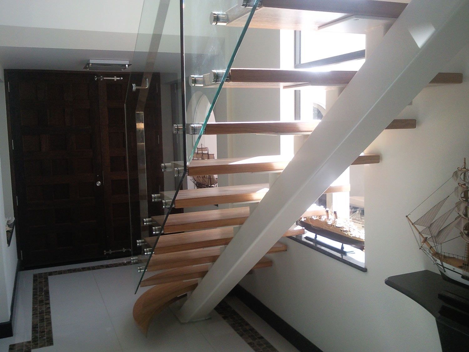 A Back View of Staircase Connected with the Glass — Glass Windows & Doors in Shoalhaven, NSW