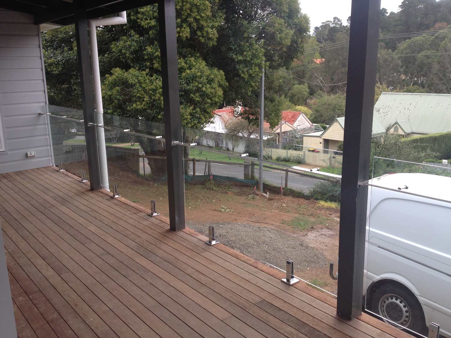 Installing Balustrades and Wood Flooring — Glass Windows & Doors in Shoalhaven, NSW