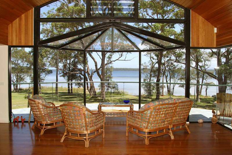 House Living Room with a Wide Outdoor View — Glass Windows & Doors in Shoalhaven, NSW