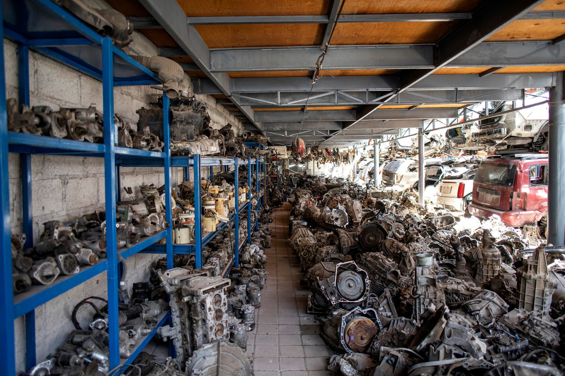 A large warehouse filled with lots of car parts.