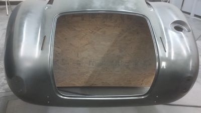 A large metal object is sitting on top of a wooden table