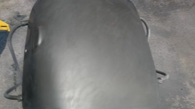 A close up of a black object on a concrete surface