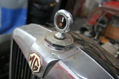 A close up of a hood ornament on a car