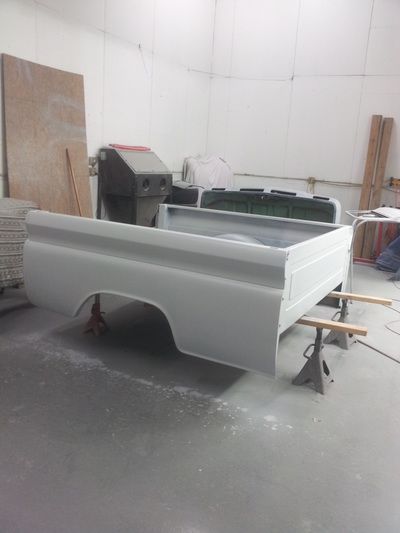 A truck bed is being built in a garage