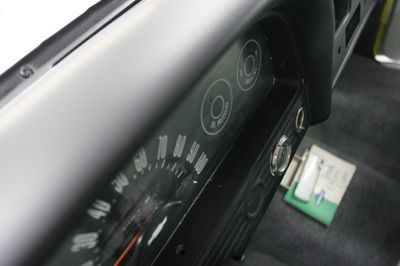 A close up of a speedometer in a car