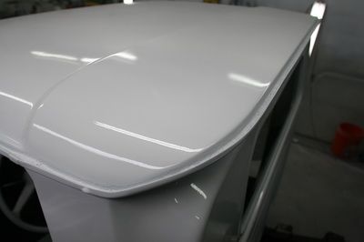 A close up of a white roof of a car