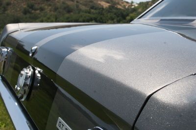 A close up of the hood of a ford mustang