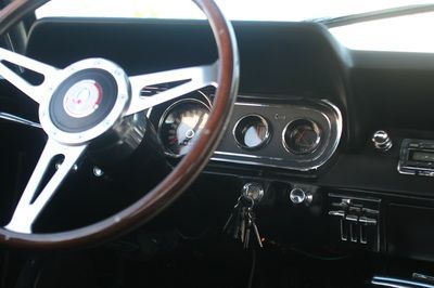 A close up of a steering wheel in a car