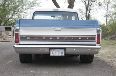 A chevrolet truck is parked on the side of the road