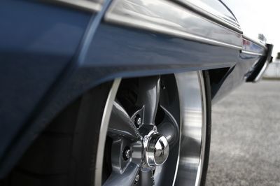 A close up of a car wheel on a road