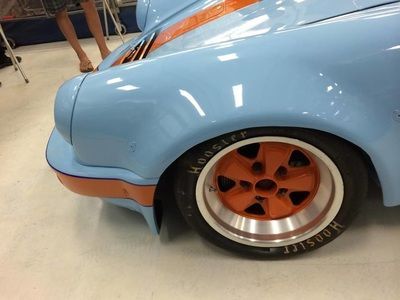 A close up of a wheel on a car that says hoosier