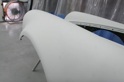 A close up of a white car part