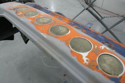 A close up of a piece of metal with holes in i