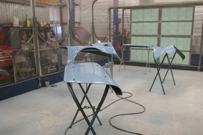 A couple of pieces of metal are sitting on a table in a room