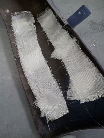 A pair of white bandages are laying on a table