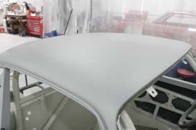 The roof of a car is being painted