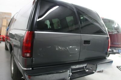 A gray suv is parked in a garage