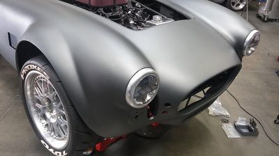 A close up of a car with the hood open
