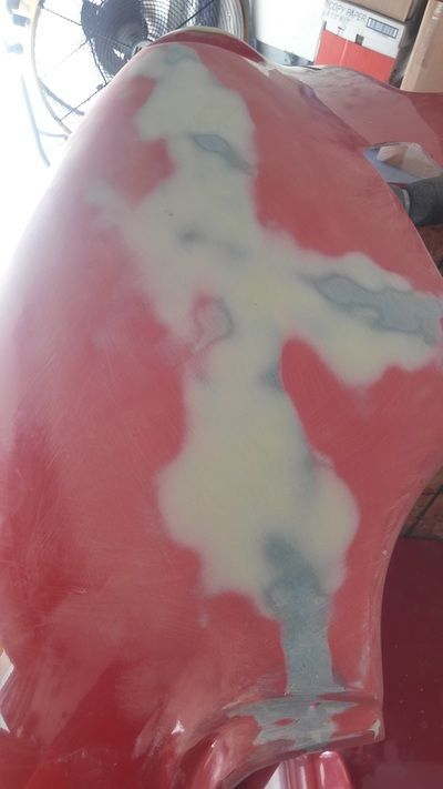 A close up of a red object with white paint on it