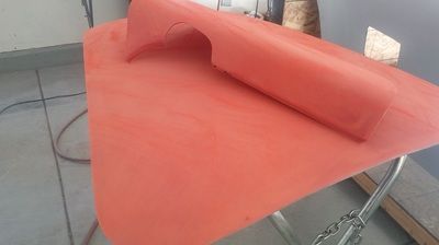 A piece of red fabric is sitting on top of a table