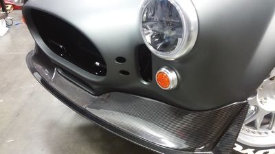 A close up of the front of a black car