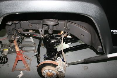 A car is being worked on in a garage