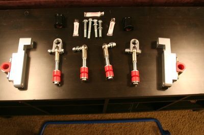 A bunch of nuts and bolts are on a table