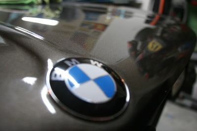 A close up of a bmw logo on a car