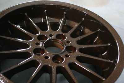 A close up of a wheel with a shiny finish